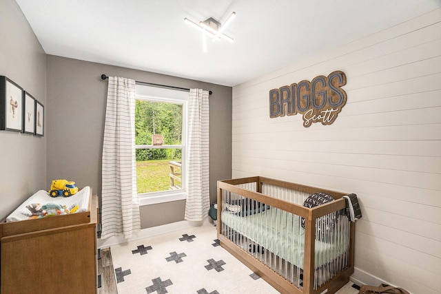 8577 Loveless Dr, Howard City, MI 49329 - bedroom with a nursery area and multiple windows