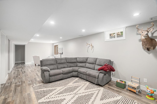 8577 Loveless Dr, Howard City, MI 49329 - living area with wood finished floors and recessed lighting