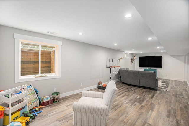 8577 Loveless Dr, Howard City, MI 49329 - living area featuring wood finished floors and recessed lighting