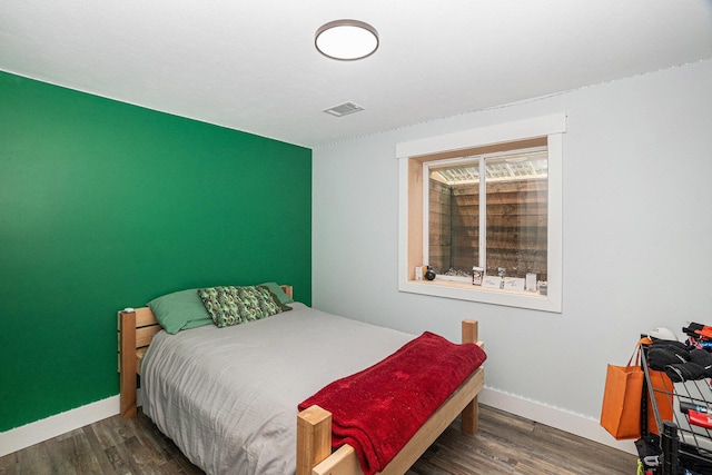 8577 Loveless Dr, Howard City, MI 49329 - bedroom with wood finished floors