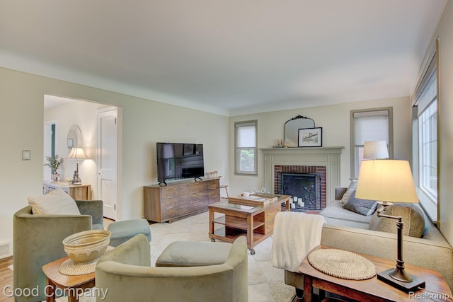 1012 W 12 Mile Rd, Royal Oak, MI 48073 - living area with healthy amount of natural light, a brick fireplace, and wood finished floors