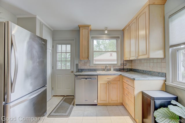 1012 W 12 Mile Rd, Royal Oak, MI 48073 - kitchen featuring stainless steel appliances, light brown cabinets, healthy amount of natural light, and decorative backsplash