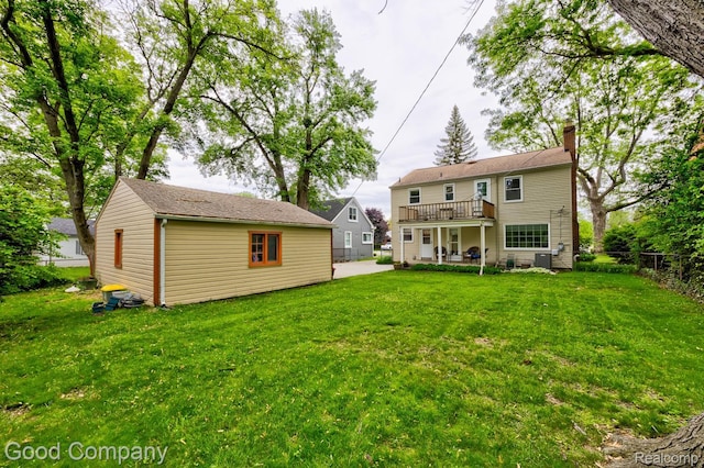 1012 W 12 Mile Rd, Royal Oak, MI 48073 - back of house with a chimney, an outdoor structure, a patio, and a wooden deck