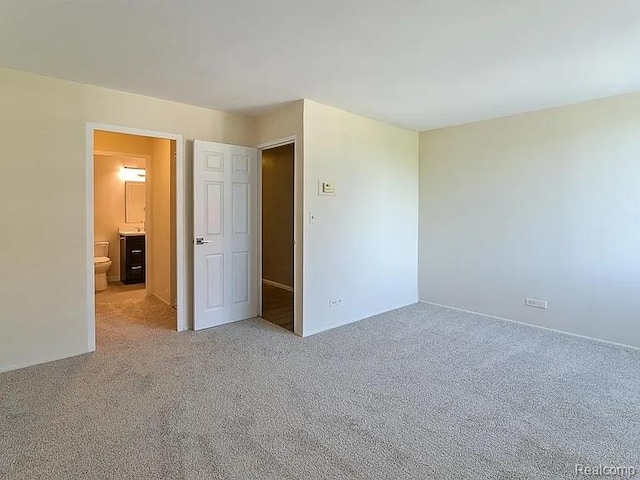 1050 Wall St Unit 2E, Ann Arbor, MI 48105 - unfurnished bedroom with light carpet