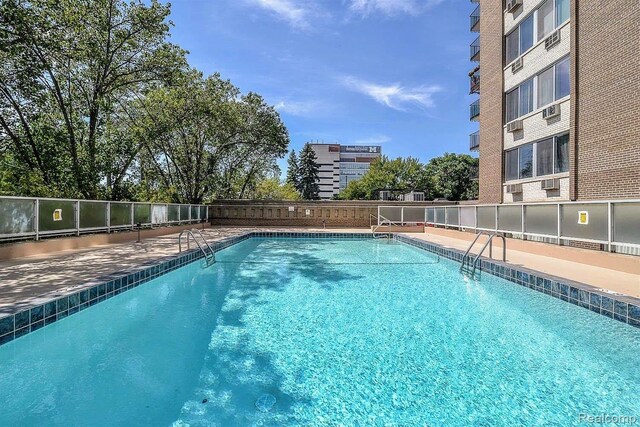 1050 Wall St Unit 2E, Ann Arbor, MI 48105 - community pool with a patio