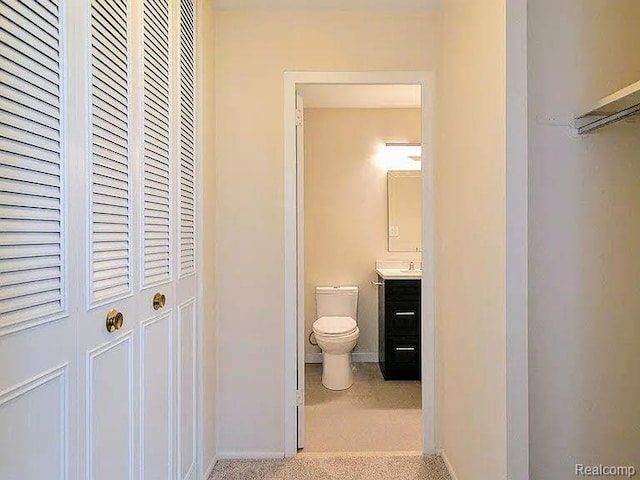 1050 Wall St Unit 2E, Ann Arbor, MI 48105 - bathroom with a closet and vanity