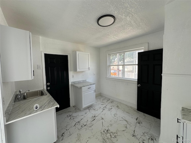 4222 High St, Ecorse, MI 48229 - laundry area featuring light marble finish flooring and a textured ceiling