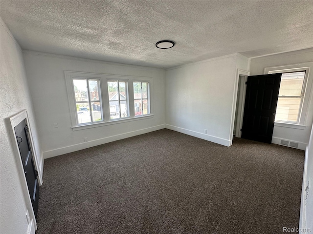 4222 High St, Ecorse, MI 48229 - unfurnished living room featuring a textured ceiling, dark colored carpet, and ornamental molding