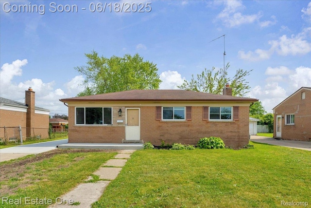 3218 E 14 Mile Rd, Rochester, MI 48092 - view of front of home with brick siding and a chimney