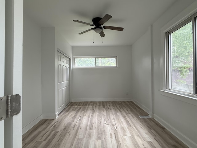 2427 Highland St, Detroit, MI 48206 - unfurnished bedroom featuring light wood-style flooring, a closet, and ceiling fan
