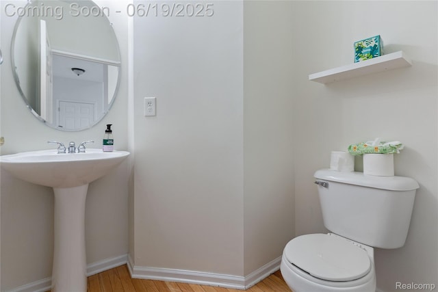 7382 Gateway Dr, West Bloomfield, MI 48322 - half bath featuring wood finished floors and toilet