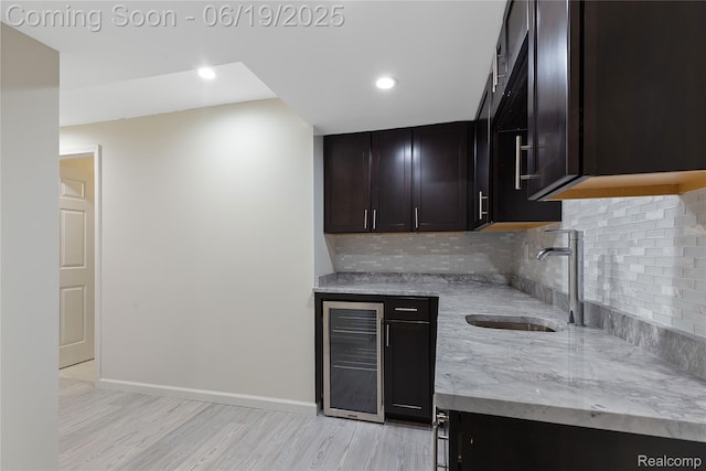 7382 Gateway Dr, West Bloomfield, MI 48322 - indoor bar featuring beverage cooler, tasteful backsplash, light wood-style flooring, and recessed lighting