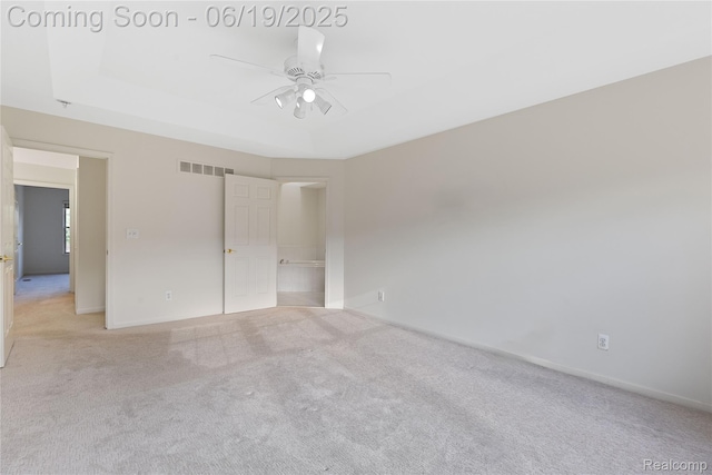 7382 Gateway Dr, West Bloomfield, MI 48322 - unfurnished bedroom with carpet, a tray ceiling, and a ceiling fan