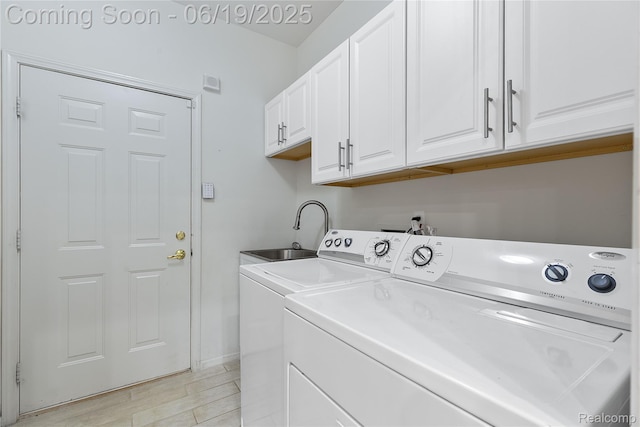 7382 Gateway Dr, West Bloomfield, MI 48322 - washroom featuring washer and dryer and cabinet space