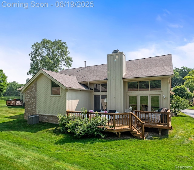 6420 Apple Grove Ln, Bloomfield Hills, MI 48301 - back of house with a chimney, a deck, a lawn, brick siding, and a shingled roof