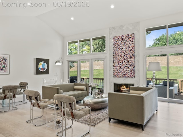6420 Apple Grove Ln, Bloomfield Hills, MI 48301 - living room featuring high vaulted ceiling, a fireplace, light wood-style flooring, and recessed lighting