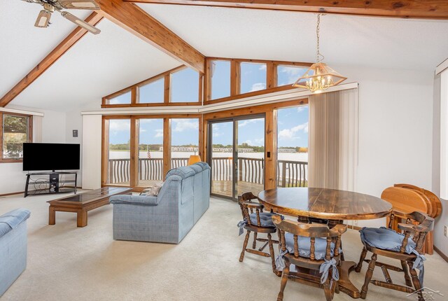 1653 Manchester Way, Gladwin, MI 48624 - carpeted living area featuring a water view, a chandelier, and ceiling fan