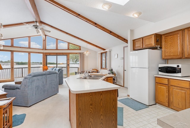 1653 Manchester Way, Gladwin, MI 48624 - kitchen with white appliances, light countertops, open floor plan, a water view, and a ceiling fan