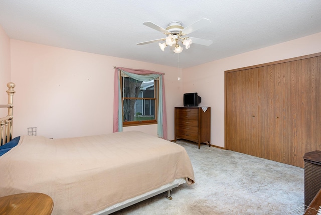 1653 Manchester Way, Gladwin, MI 48624 - bedroom with carpet flooring, a closet, and ceiling fan