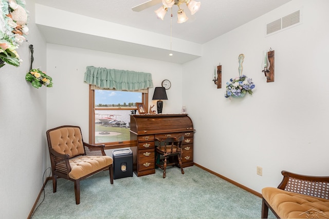1653 Manchester Way, Gladwin, MI 48624 - sitting room featuring carpet floors, ceiling fan, and a desk