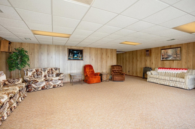 1653 Manchester Way, Gladwin, MI 48624 - carpeted living area featuring a drop ceiling and wood walls