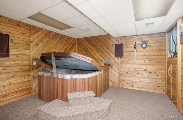 1653 Manchester Way, Gladwin, MI 48624 - bedroom with a paneled ceiling, carpet flooring, and wood walls