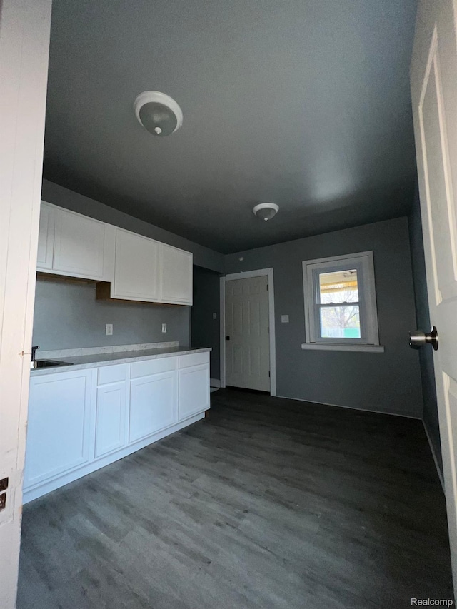 13763 Sparling St, Hamtramck, MI 48212 - kitchen with white cabinets and dark wood finished floors
