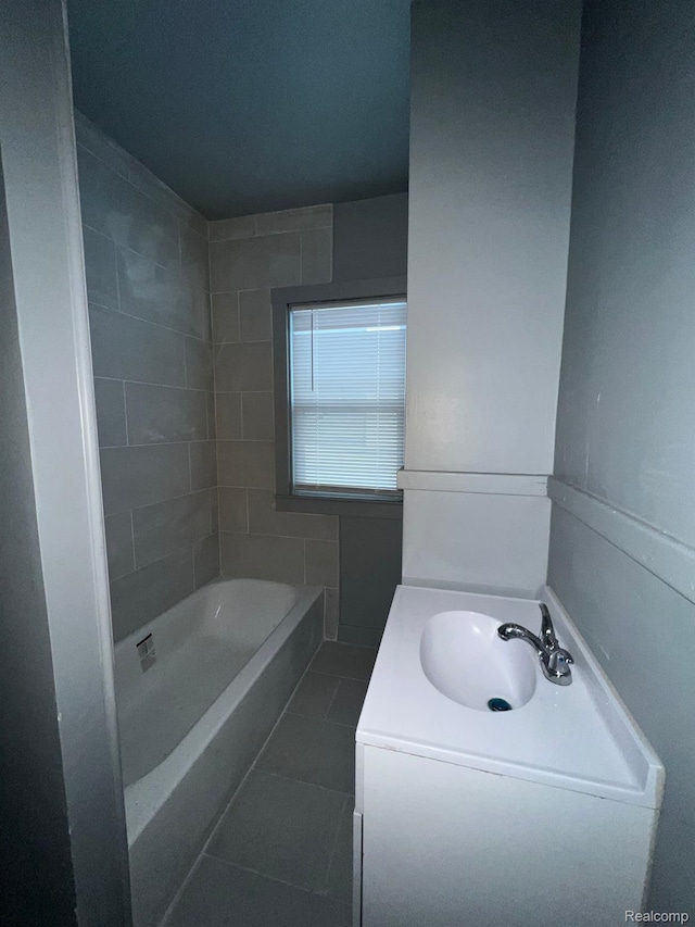 13763 Sparling St, Hamtramck, MI 48212 - full bath with tile patterned floors, a tub to relax in, and vanity