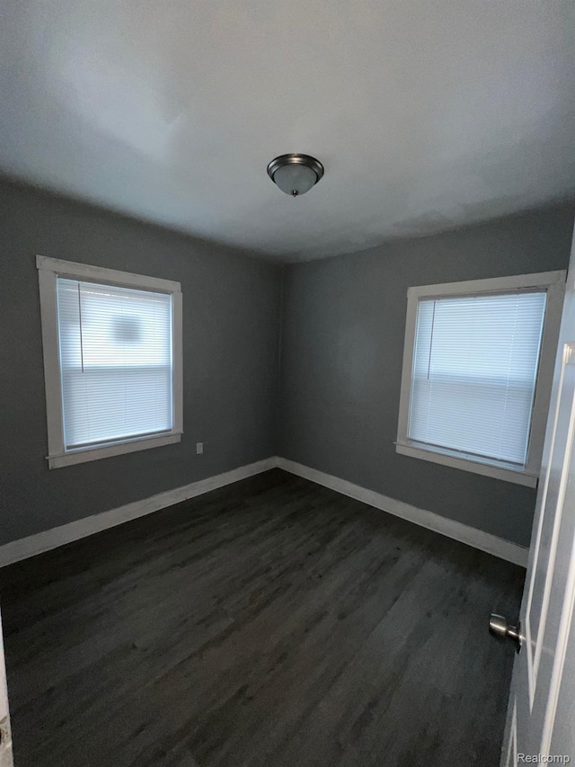 13763 Sparling St, Hamtramck, MI 48212 - unfurnished room with dark wood-style floors and baseboards