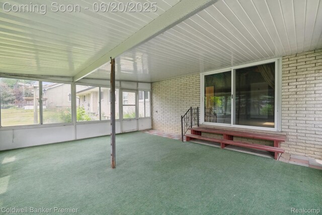 8077 Casa Mia Dr, White Lake, MI 48386 - unfurnished sunroom featuring entry steps