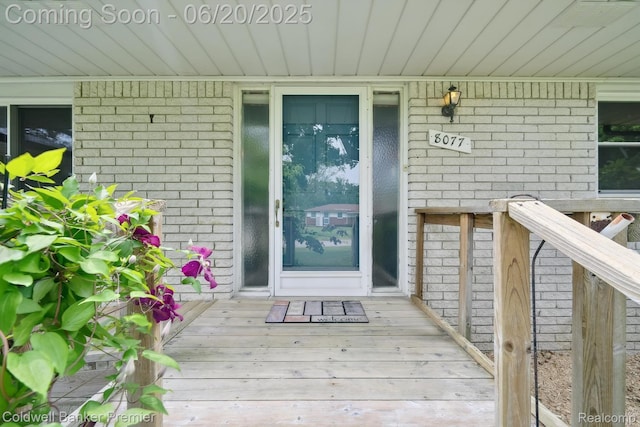 8077 Casa Mia Dr, White Lake, MI 48386 - entrance to property featuring brick siding and covered porch