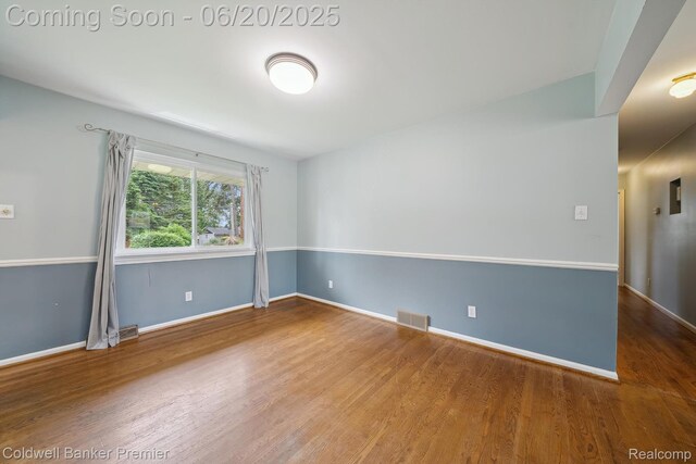 8077 Casa Mia Dr, White Lake, MI 48386 - empty room featuring wood finished floors