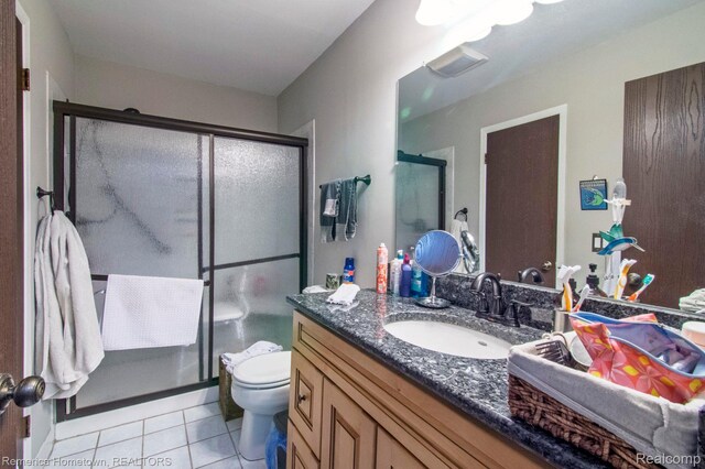 41195 Southwind Dr, Canton, MI 48188 - full bath with vanity, a shower stall, and tile patterned floors