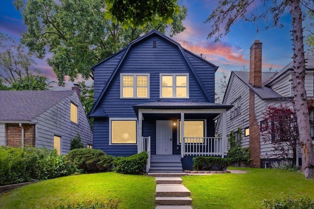 18419 Faust Ave, Detroit, MI 48219 - colonial inspired home with a porch, a front yard, and a gambrel roof