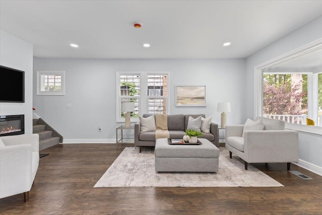 18419 Faust Ave, Detroit, MI 48219 - living area featuring plenty of natural light, wood finished floors, recessed lighting, and a glass covered fireplace