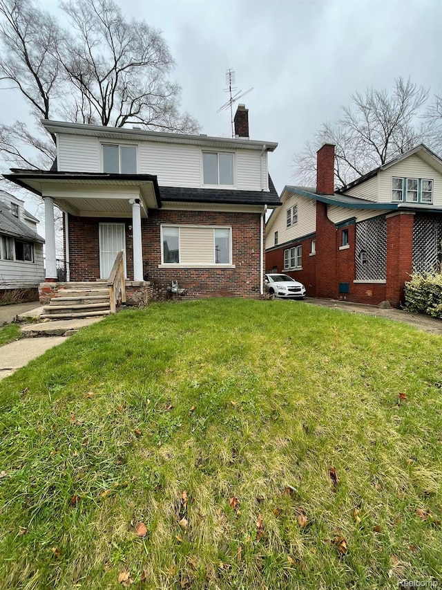 14200 Whitcomb St, Detroit, MI 48227 - back of property with brick siding, a yard, and a chimney