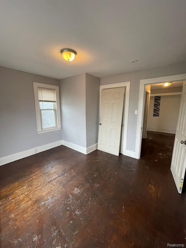 14200 Whitcomb St, Detroit, MI 48227 - unfurnished bedroom featuring baseboards and hardwood / wood-style flooring