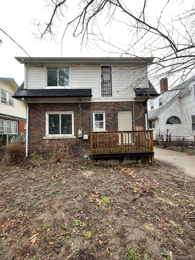 14200 Whitcomb St, Detroit, MI 48227 - back of property featuring a wooden deck and brick siding