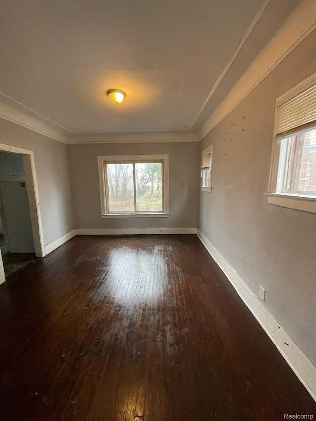 14200 Whitcomb St, Detroit, MI 48227 - unfurnished room featuring wood-type flooring, ornamental molding, and plenty of natural light