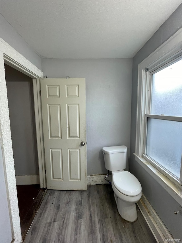 14200 Whitcomb St, Detroit, MI 48227 - bathroom featuring toilet and wood finished floors