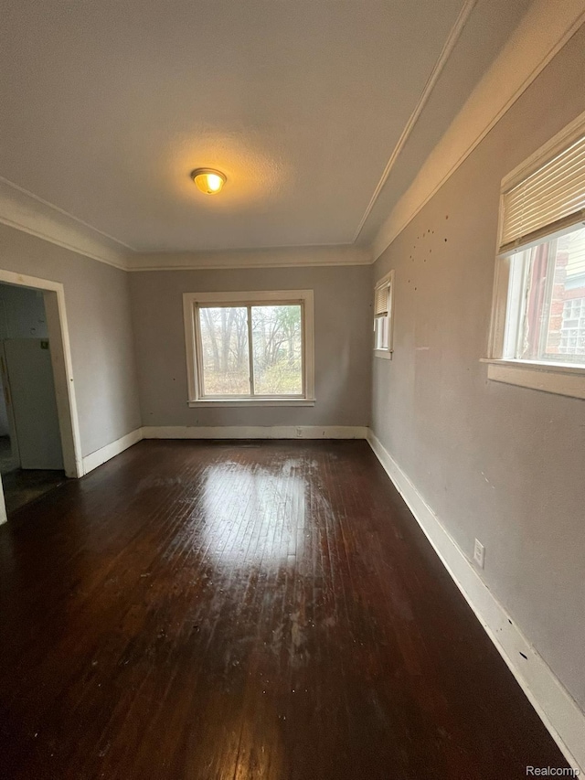 14200 Whitcomb St, Detroit, MI 48227 - unfurnished room featuring crown molding, wood-type flooring, and plenty of natural light