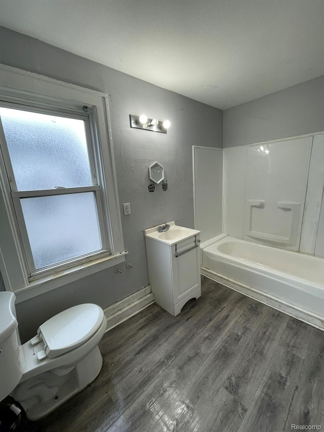 14200 Whitcomb St, Detroit, MI 48227 - bathroom featuring vanity, wood finished floors, and washtub / shower combination