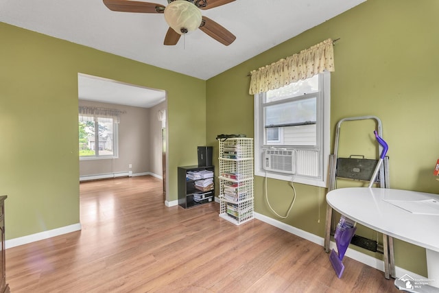 234 Crampton Dr, Monroe, MI 48162 - office featuring baseboard heating, wood finished floors, a ceiling fan, and cooling unit