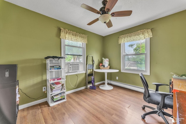 234 Crampton Dr, Monroe, MI 48162 - office with a baseboard heating unit, healthy amount of natural light, wood finished floors, ceiling fan, and a textured ceiling