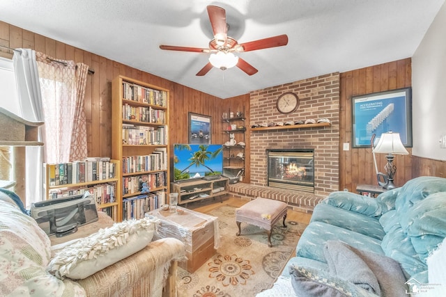 234 Crampton Dr, Monroe, MI 48162 - living area featuring wooden walls, ceiling fan, a brick fireplace, wood finished floors, and built in features