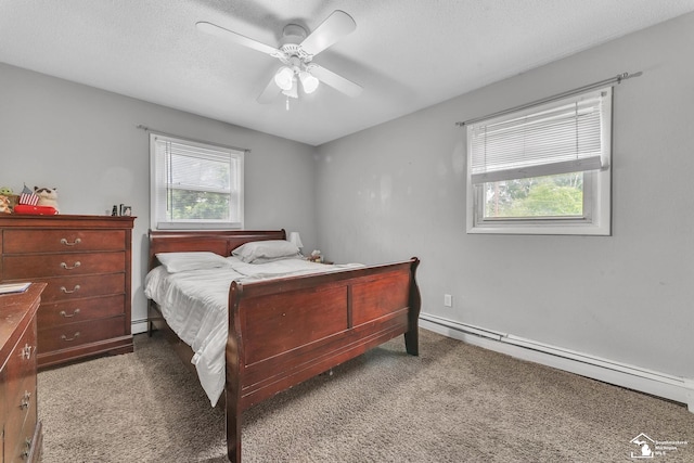 234 Crampton Dr, Monroe, MI 48162 - carpeted bedroom with a baseboard radiator, multiple windows, and ceiling fan