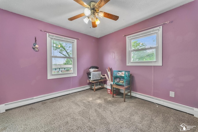 234 Crampton Dr, Monroe, MI 48162 - sitting room featuring baseboard heating, healthy amount of natural light, carpet flooring, and a ceiling fan