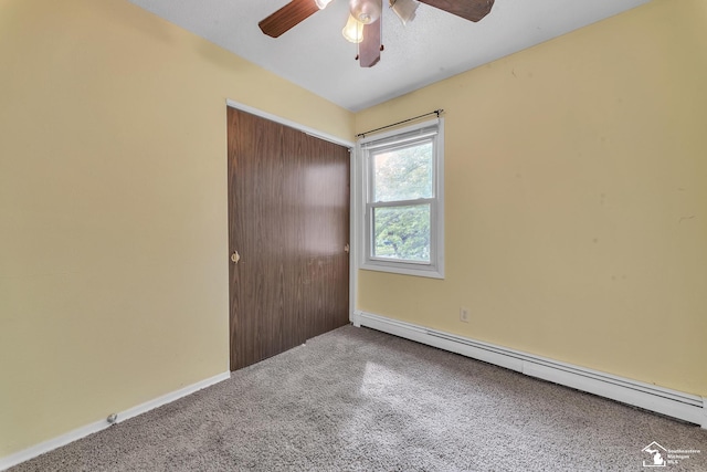 234 Crampton Dr, Monroe, MI 48162 - unfurnished bedroom with a baseboard heating unit, carpet, a closet, and ceiling fan