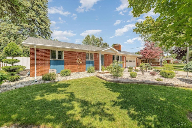 4170 Clement Dr, Saginaw, MI 48603 - single story home with an attached garage, a chimney, and brick siding