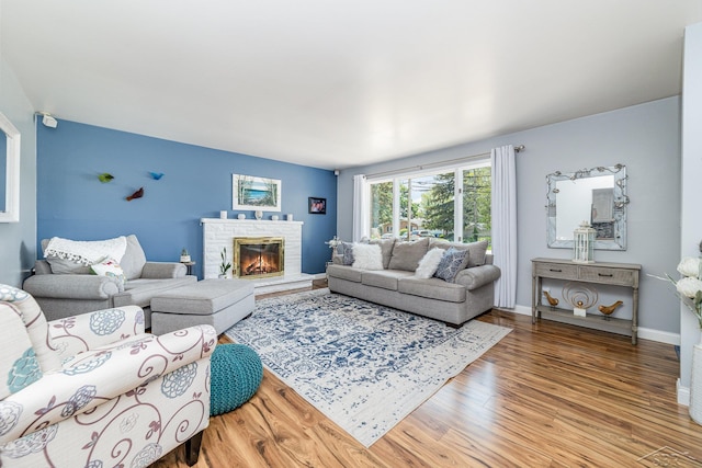 4170 Clement Dr, Saginaw, MI 48603 - living area with wood finished floors and a stone fireplace